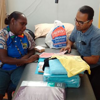 Image of researcher Jackson Thomas with an Aboriginal Health Practitioner