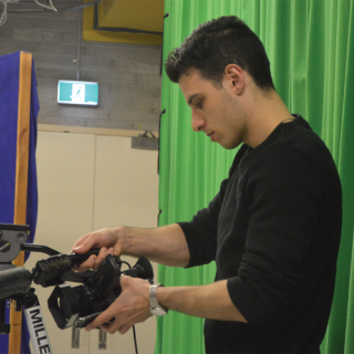 UC film production student Jordan Devitre filming ‘Through My Eyes’ in the TV studio on campus