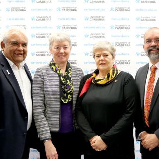 L-R: University Chancellor Professor Tom Calma, acting Vice-Chancellor Professor Frances Shannon, Auriel Bloomfield and Professor Peter Radoll. Photo: Kim Pham.