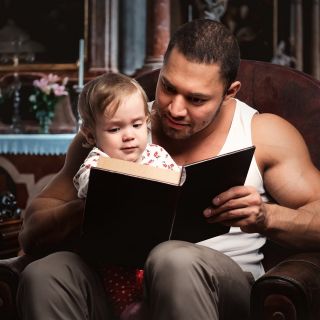 Father reading story to child