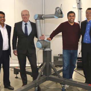 Photo of Dr Lakmal Seneviratne from Khalifa University Robotics Institute, Scott Russell from Tactical Research, and Dr Damith Herath and Dr Roland Goecke from the University of Canberra. 