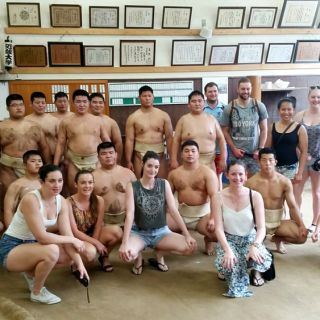 UC students with Japanese sumo wrestlers