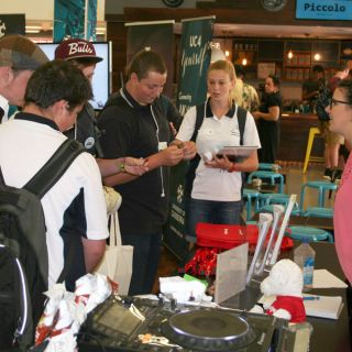 High school students visiting a booth