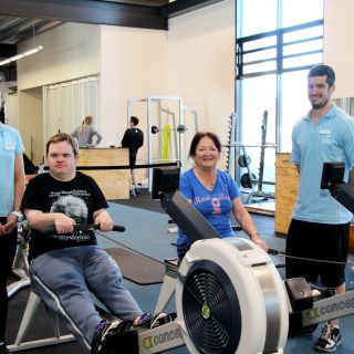 UC exercise physiology students Rebecca Eisenhauer (left) and Brady Foreman (right) training Daniel and Denise Brown