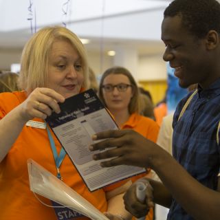 Visitors speaking with academic staff about the courses on offer at the University of Canberra Open Day