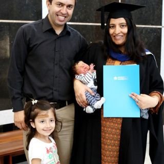 UC graduate Dilshad Pari with her family