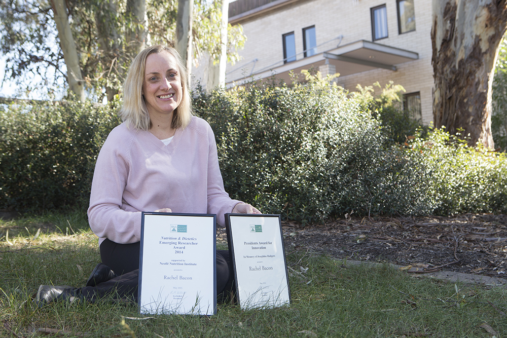 Rachel Bacon pictured with her two Dietitians Association of Australia awards